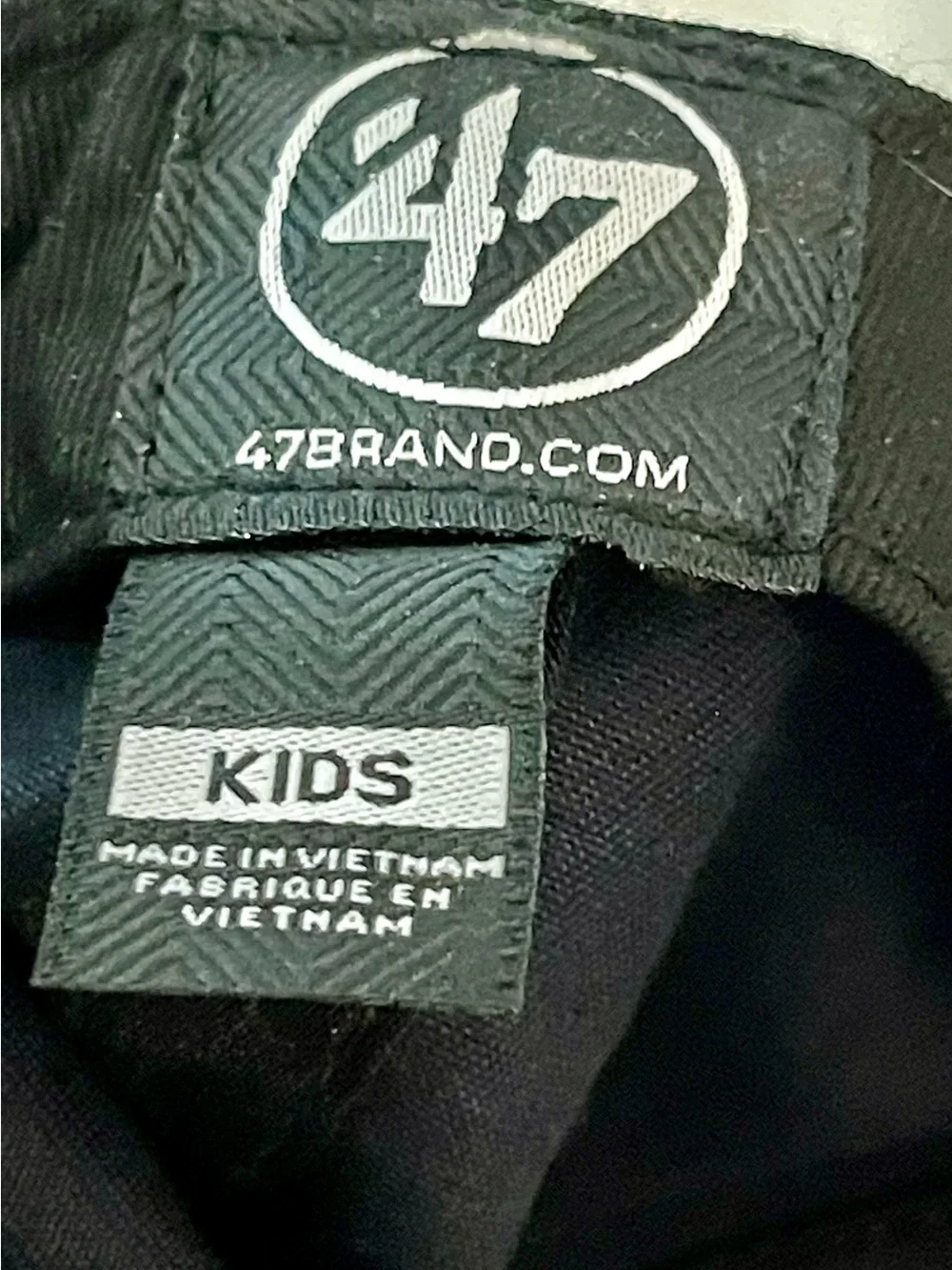 Genuine Merchandise Black Cap with White Logo Tag